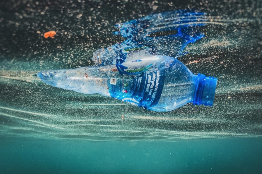 Empty water bottle floating in water